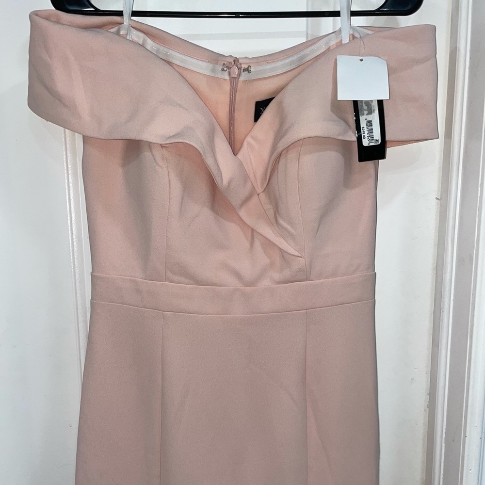 Xscape evening dress in the color peach, size 10, new, never worn with tags.